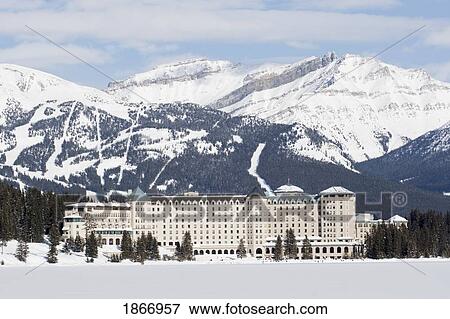 Stock Photo - Chateau Lake Louise And Ski Hills In Winter; Banff National Park, Alberta, Canada. Fotosearch