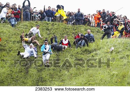 Stock Image - Cheese Rolling at Coopers Hill; Brockworth, Gloucestershire, England. Fotosearch