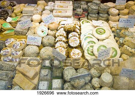 Cheeses Laid Out For Sale In A Shop, Paris, France View Large Photo Image Stock Photograph - Cheeses Laid Out For Sale In A Shop, Paris, France. Fotosearch