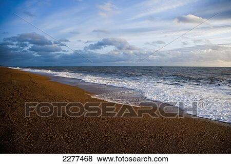 Chesil beach with blue sky and cloud; Devon, England View Large Photo Image Stock Photo - Chesil beach with blue sky and cloud; Devon, England. Fotosearch