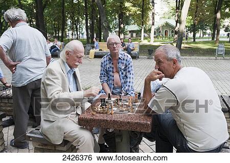 Chess players in a park; Kiev, Ukraine View Large Photo Image Stock Photograph - Chess players in a park; Kiev, Ukraine. Fotosearch