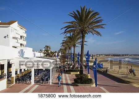 Stock Image - Chiclana De La Frontera, Andalusia, Spain; The Promenade Along The Water. Fotosearch