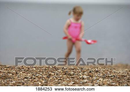 Child In Pink Bathing Suite Playing On The Beach View Large Photo Image Stock Image - Child In Pink Bathing Suite Playing On The Beach. Fotosearch