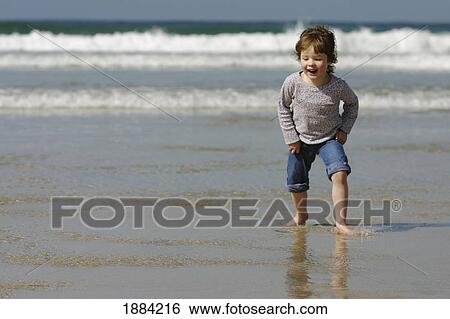 Stock Photograph - Child On Sennen Cove Beach. Fotosearch