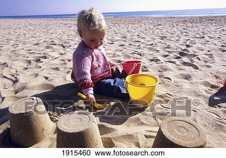Child Playing In Sand View Large Photo Image Stock Image - Child Playing In Sand. Fotosearch