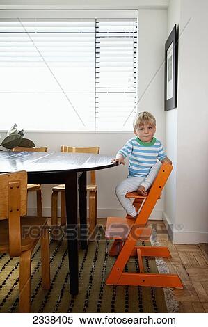Child Sitting On Unique High Chair; San Francisco, California, Usa View Large Photo Image Stock Photography - Child Sitting On Unique High Chair; San Francisco, California, Usa. Fotosearch