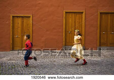 Children (5-7) Running In Street At International Carnival Of Puerto De La Crux In Gran Coso Apoteosis View Large Photo Image Stock Photograph - Children (5-7) Running In Street At International Carnival Of Puerto De La Crux In Gran Coso Apoteosis. Fotosearch