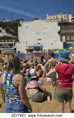 Children and parents watching a Punch and Judy puppet show at Viking Bay; Broadstairs, Kent, England View Large Photo Image Stock Image - Children and parents watching a Punch and Judy puppet show at Viking Bay; Broadstairs, Kent, England. Fotosearch