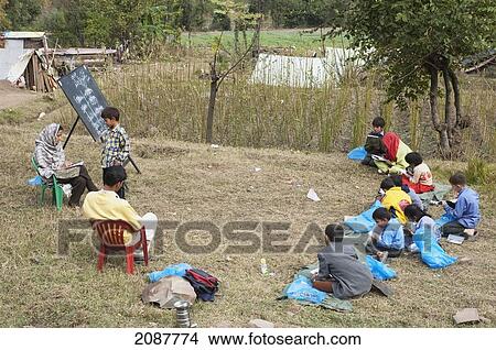 Picture - Children Attending An English Class In An Open Air School Set Up After The 8 October 2005 Earthquake, Subri, Azad Kashmir, Pakistan. Fotosearch
