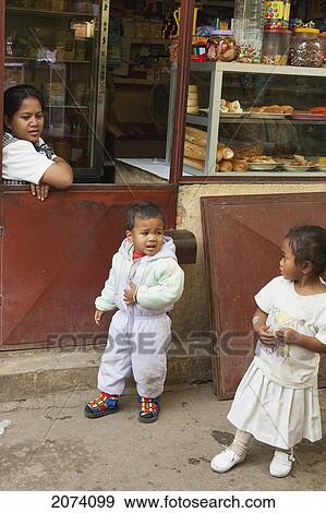 Stock Photo - Children By A Food Store In Antananarivo, Madagascar. Fotosearch