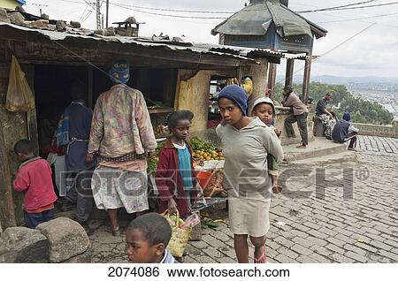 Stock Photograph - Children By A Food Store In Antananarivo, Madagascar. Fotosearch