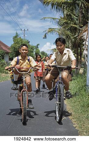Children Cycling Home From School View Large Photo Image Stock Image - Children Cycling Home From School. Fotosearch