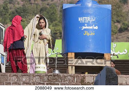 Children Getting Purified Water From A Tank Set Up After The 8 October 2005 Earthquake, Garhi Dopatta, Azad Jammu & Kashmir, Pakistan View Large Photo Image Stock Photo - Children Getting Purified Water From A Tank Set Up After The 8 October 2005 Earthquake, Garhi Dopatta, Azad Jammu & Kashmir, Pakistan. Fotosearch