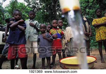 Stock Photo - Children In Front Of Well; Nigeria. Fotosearch