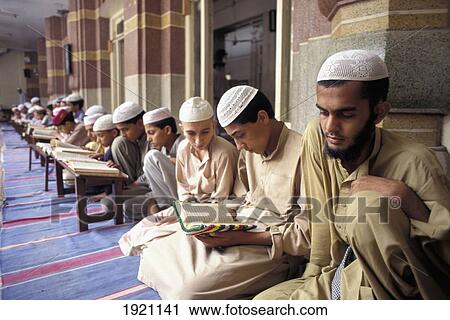 Stock Image - Children Learning The Quoran At Mosque School. Fotosearch