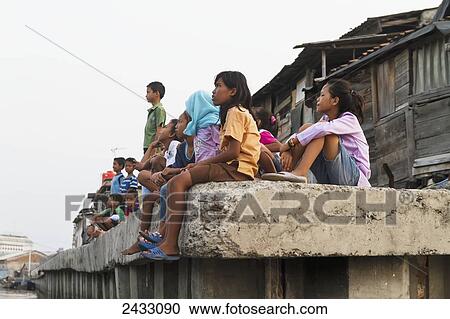 Children on a dock in Sunda Kelapa Harbour, Jakarta, Java, Indonesia View Large Photo Image Stock Image - Children on a dock in Sunda Kelapa Harbour, Jakarta, Java, Indonesia. Fotosearch