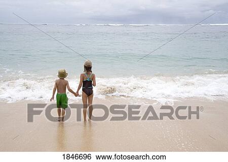 Children On Sandy Beach Looking At Sea View Large Photo Image Stock Photograph - Children On Sandy Beach Looking At Sea. Fotosearch
