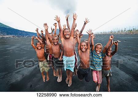 Children playing on ash plains of Tavurvur volcano; Rabaul, Papua New Guinea View Large Photo Image Stock Image - Children playing on ash plains of Tavurvur volcano; Rabaul, Papua New Guinea. Fotosearch