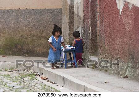 Children Putting Clothes On A Bench, Coroico, La Paz Department, Bolivia View Large Photo Image Stock Image - Children Putting Clothes On A Bench, Coroico, La Paz Department, Bolivia. Fotosearch