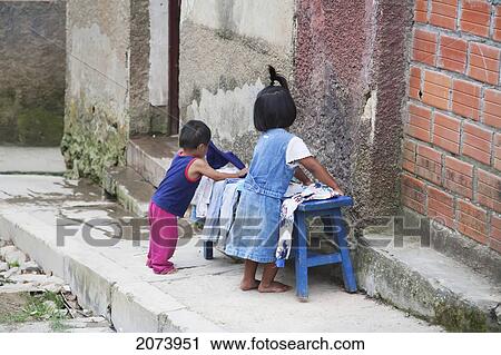 Children Putting Clothes On A Bench, Coroico, La Paz Department, Bolivia View Large Photo Image Stock Image - Children Putting Clothes On A Bench, Coroico, La Paz Department, Bolivia. Fotosearch