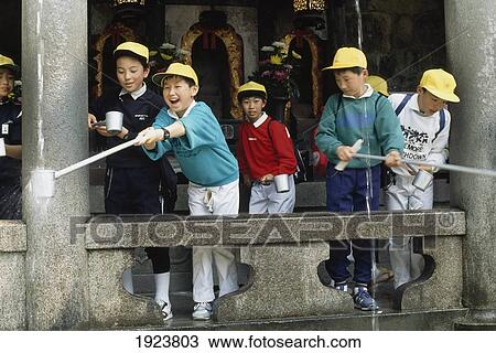 Stock Image - Children Reach For Pure Water. Fotosearch