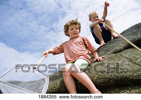 Children Rockpooling Along Seaside View Large Photo Image Stock Photography - Children Rockpooling Along Seaside. Fotosearch