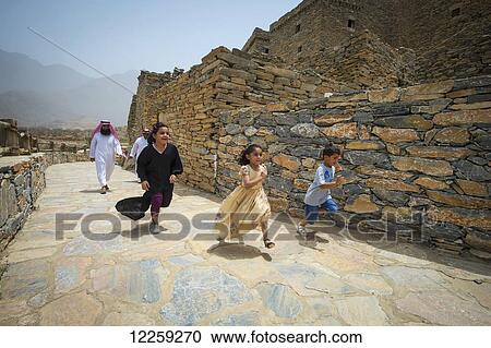 Children running along fortress wall; Taif, Saudi Arabia View Large Photo Image Stock Image - Children running along fortress wall; Taif, Saudi Arabia. Fotosearch