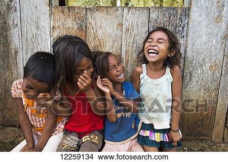 Picture - Children sharing a laugh; Baucau, Timor-Leste. Fotosearch