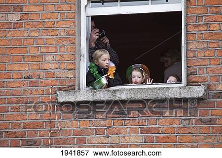Children Watching The Saint Patrick's Day Parade From A Window; Dublin Ireland View Large Photo Image Stock Photo - Children Watching The Saint Patrick's Day Parade From A Window; Dublin Ireland. Fotosearch