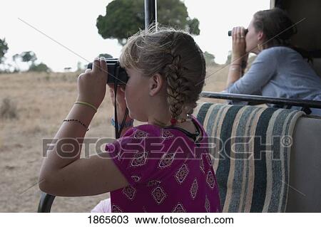 Stock Image - Children With Binoculars, Kenya, Africa. Fotosearch