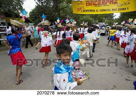 Stock Photo - Children With Festive Baskets In The Entrada De Comadritas Parade During The Carnaval Chapaco, Tarija, Bolivia. Fotosearch