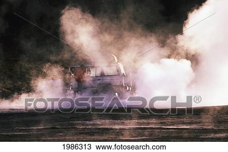 Stock Image - Chile, Atacama Desert, El Tatio Geysers, People Standing On Steaming Rocks.. Fotosearch