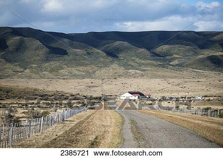 Stock Image - Chilean farm house at the end of the road; Punta Arenas, Magallanes, Chile. Fotosearch