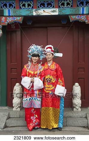 China, Beijing, Young man and woman dressed in colorful costumes View Large Photo Image Stock Photo - China, Beijing, Young man and woman dressed in colorful costumes. Fotosearch