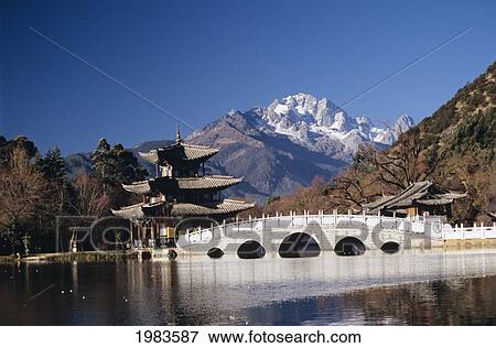Stock Photo - China, Black Dragon Pool Park with Five Phoenix Pavilion; Lijiang. Fotosearch