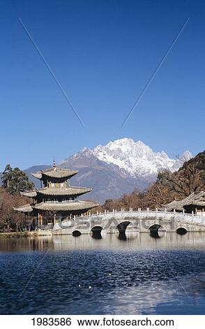 Stock Photograph - China, Black Dragon Pool Park with Five Phoenix Pavilion; Lijiang. Fotosearch
