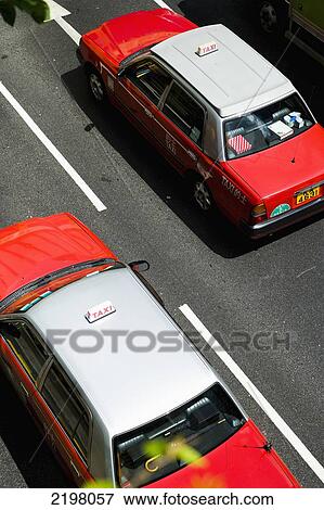 China, Classic Red and White style Toyota Hong Kong Taxis; Hong Kong Island View Large Photo Image Stock Photo - China, Classic Red and White style Toyota Hong Kong Taxis; Hong Kong Island. Fotosearch