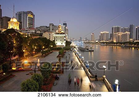 Picture - China, Guangdong, River and promenade at dusk; Guangzhou. Fotosearch