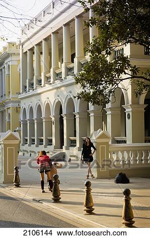 Picture - China, Guangdong, Shamian Island; Guangzhou, People in front of building. Fotosearch