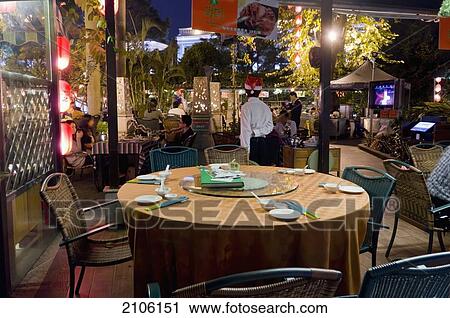 Stock Image - China, Guangdong, Shamian Island; Guangzhou, Restaurant at night. Fotosearch