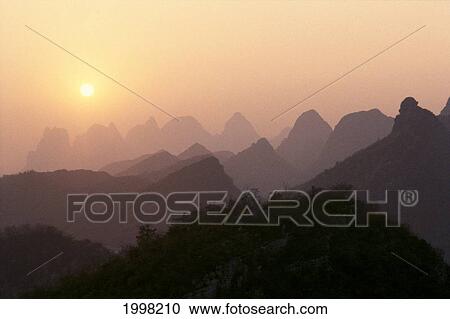 China, Guilin, Piled Silk Mountains, At Sunset, Orange Sky B1785 View Large Photo Image Stock Image - China, Guilin, Piled Silk Mountains, At Sunset, Orange Sky B1785. Fotosearch