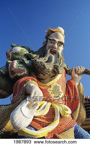 Stock Image - China, Hong Kong, Close up Of Colorful Statue in Tin Hua Temple; Refuse Bay. Fotosearch