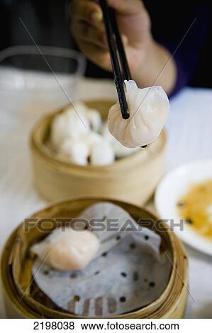 Stock Photo - China, Hong Kong, Kowloon, Chinese restaurant Dim Sum; Mong Kok. Fotosearch