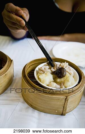 Stock Photo - China, Hong Kong, Kowloon, Chinese restaurant Dim Sum; Mong Kok. Fotosearch