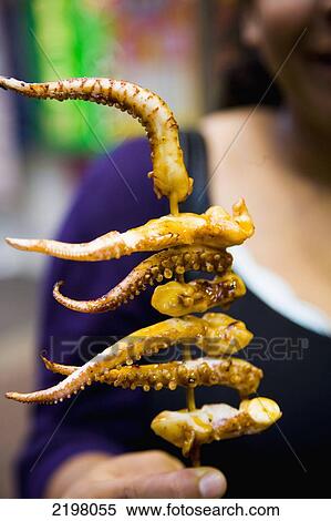 China, Hong Kong, Kowloon, Squid tentacles grilled on stick; Mong Kok View Large Photo Image Stock Photography - China, Hong Kong, Kowloon, Squid tentacles grilled on stick; Mong Kok. Fotosearch