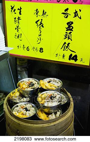Stock Image - China, Hong Kong, Mong Kok market; Kowloon, cooked in bamboo steamer, Chinese style fast food. Fotosearch