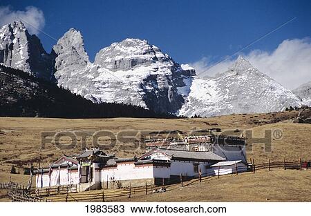 China, Jade Dragon Snow Mountain in background; Lijiang, Old buddhist temple on Yak meadow View Large Photo Image Stock Image - China, Jade Dragon Snow Mountain in background; Lijiang, Old buddhist temple on Yak meadow. Fotosearch