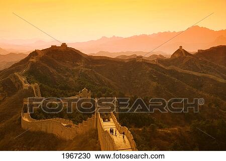 Stock Image - China, Jinshanling, The Great Wall Of China, Glow Of Sunset Over Hills And Sky.. Fotosearch