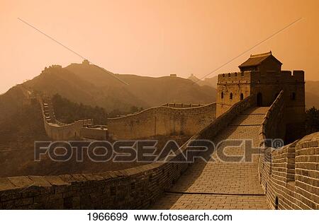 Stock Photo - China, Jinshanling, The Great Wall Of China, Glow Of Sunset Over Hills And Sky.. Fotosearch