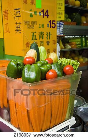 Stock Photo - China, Kowloon. Hong Kong, Fruit juice and smoothies shop; Mong Kok. Fotosearch